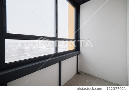 A stunning modern balcony view in a beautiful winter landscape that captivates and inspires awe 122377021