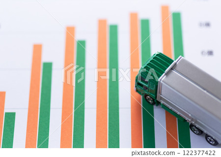 Logistics company performance graph and transportation truck Logistics company performance graph and transportation truck 122377422