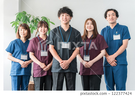 Doctors, caregivers, and osteopaths wearing scrubs Doctors, caregivers, and osteopaths wearing scrubs 122377424