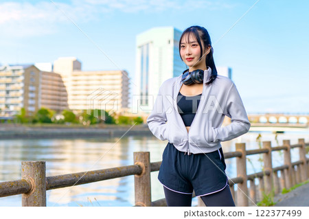 Cool woman walking along the river Posing Diet Walking Exercise Trimming 122377499