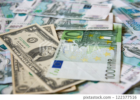 background of paper bills dollars, euros and rubles. Currency exchange rate 122377516
