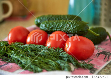 Tomatoes, cucumbers and green dill close-up, fresh harvest, preparation for salad, diet food Tomatoes, cucumbers and green dill close-up, fresh harvest, preparation for salad, diet food 122377522
