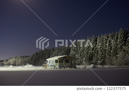 Serene Winter Retreat A Delightfully Cozy Cabin Nestled in a Beautiful Snowy Forest Setting 122377575