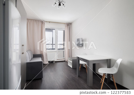 An Elegant Stylish Modern Living Space Featuring a Chic Minimalist Design Approach 122377583