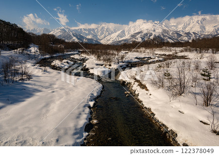 Clear streams and snow in the Northern Alps, Hakuba Village, Nagano Prefecture 122378049
