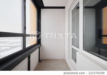 The modern balcony has a lovely view with minimalist decor and plenty of natural light The modern balcony has a lovely view with minimalist decor and plenty of natural light 122378399