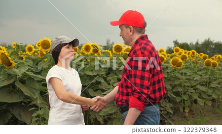 Agriculture, teamwork, business partner farmer agriculture, handshake sign of deal, harvest, fresh soil grow crops, farmer working hand tablet, handshake sign of deal, development modern agriculture Agriculture, teamwork, business partner farmer agriculture, handshake sign of deal, harvest, fresh soil grow crops, farmer working hand tablet, handshake sign of deal, development modern agriculture 122379348