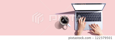 Person using a laptop computer 122379501