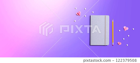 Gray notebook with paper hearts 122379508