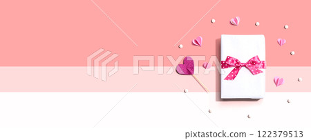 Gift box with pink paper hearts Gift box with pink paper hearts 122379513