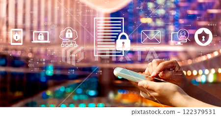 Data protection concept with person using a smartphone in city at night 122379531