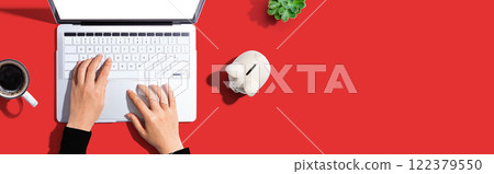 Laptop computer with piggy bank 122379550