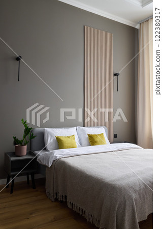 A Modern Minimalist Bedroom featuring Natural Elements and Soft Textures for comfort and style A Modern Minimalist Bedroom featuring Natural Elements and Soft Textures for comfort and style 122380317