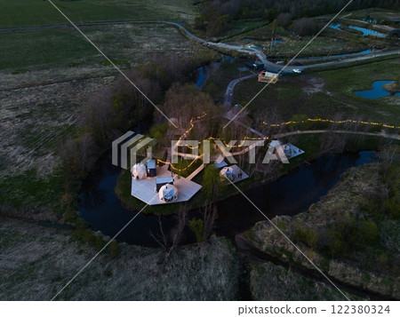 A stunning aerial perspective showcasing a unique glamping retreat nestled in natures beauty 122380324