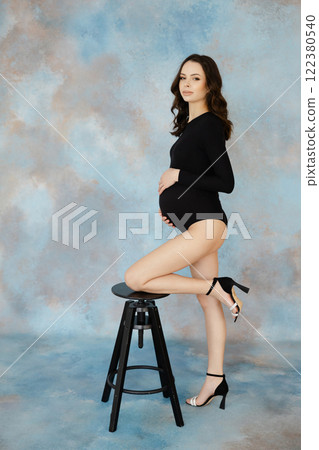 Expectant Woman Posing with Elegant Style 122380540