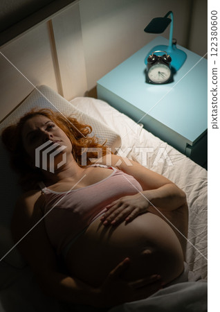 Pregnant woman suffers from insomnia.  122380600