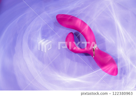 Sex toy in the glare of light. Sex toy in the glare of light. 122380963