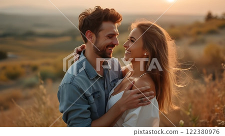 man and a woman are standing close to each other, smiling. man and a woman are standing close to each other, smiling. 122380976