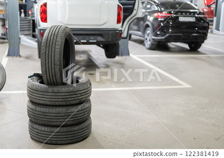 Changing tires for a car according to the season. Changing tires for a car according to the season. 122381419