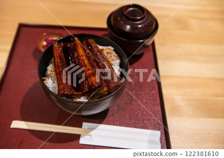 Eel teriyaki rice bowl or grill unagi don with miso soup. Japanese food Eel teriyaki rice bowl or grill unagi don with miso soup. Japanese food 122381610