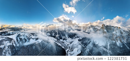 Aerial drone panorama of the Corvara village covered in snow Aerial drone panorama of the Corvara village covered in snow 122381731