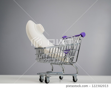 Vacuum Stimulator Sex Toy in Miniature Shopping Cart. Vacuum Stimulator Sex Toy in Miniature Shopping Cart. 122382013