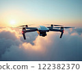 Drone flying through clouds at sunset over a serene landscape in the evening sky 122382370
