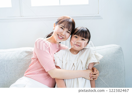 Mother and 9 year old daughter Mother and 9 year old daughter 122382467