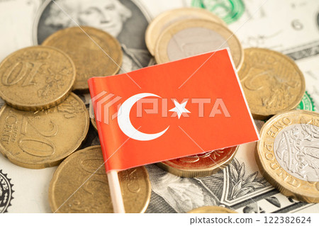 Turkey flag on coin and banknote money, finance trading investment business currency. Turkey flag on coin and banknote money, finance trading investment business currency. 122382624