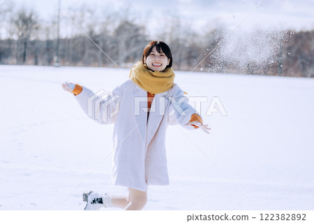 Playing in the snow with her Playing in the snow with her 122382892