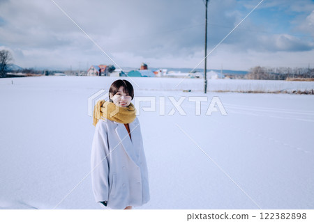 Playing in the snow with her Playing in the snow with her 122382898