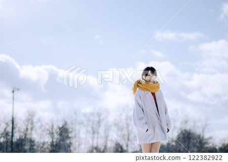 Playing in the snow with her 122382922