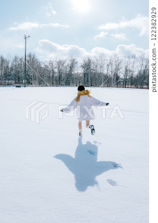 Playing in the snow with her Playing in the snow with her 122382929