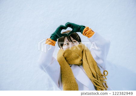 Playing in the snow with her 122382949