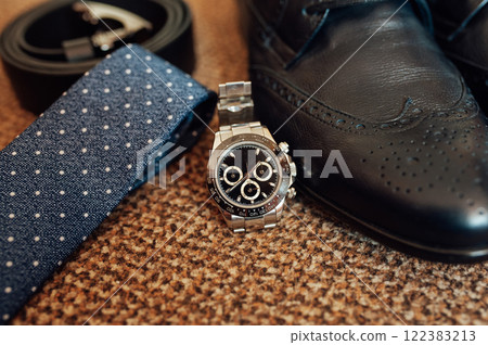 Closeup of elegant stylish brown male accessories isolated on white gray background. Preparation for wedding concept 122383213