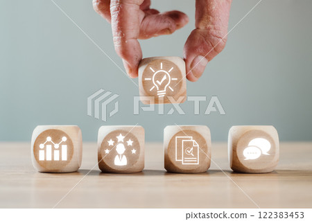 Wooden blocks with feedback and innovation icons representing business communication and growth concepts. Wooden blocks with feedback and innovation icons representing business communication and growth concepts. 122383453
