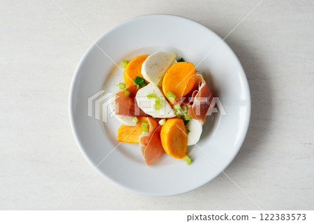 Persimmon and turnip marinade 122383573