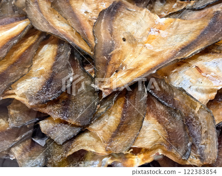 Dried fish artfully displayed at a busy morning market 122383854