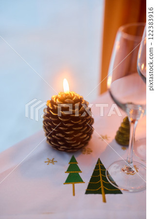 Create a Cozy Pinecone Candle Centerpiece for Your Holiday Decor and Winter Celebrations 122383916