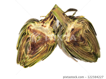 Cooked fried halves artichokes on white plate Cooked fried halves artichokes on white plate 122384227