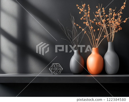 Minimalist arrangement of ceramic vases on a dark shelf 122384580