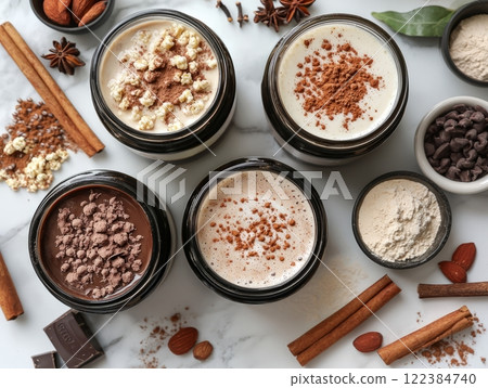 Protein latte mixes with spices and chocolate in flat lay Protein latte mixes with spices and chocolate in flat lay 122384740