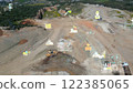 aerial view shot mining, dumpers, quarrying extractive industry stripping work. Big Mining Trucks. View from drone at opencast mining with lots of machinery trucks. High quality photo 122385065