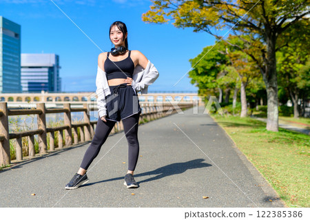 Cool woman walking along the river Posing Diet Walking Exercise Cool woman walking along the river Posing Diet Walking Exercise 122385386