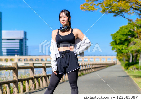 Cool woman walking along the river Posing Diet Walking Exercise Trimming 122385387