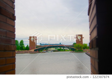 Tenmon Bridge seen through the gaps in the pillars at Fugan Canal Kansui Park 122387874
