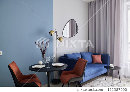 Modern Living Room with Stylish Dcor and Dining Area 122387900