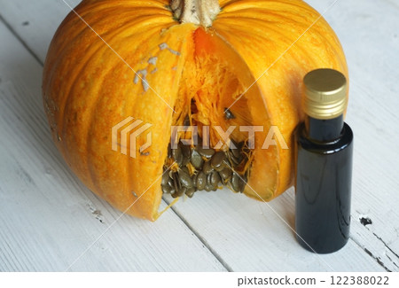 Oil pumpkin cultivated for its seeds on white table. 122388022