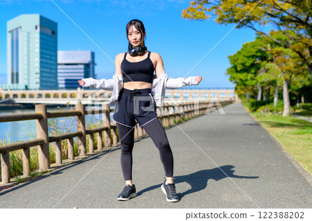 Cool woman walking along the river Posing Diet Walking Exercise 122388202
