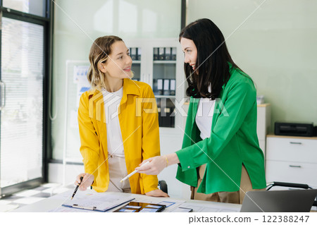 Creative digital development agency. developer team brainstorming on their project with laptop, smartphone and digital tablet. 122388247